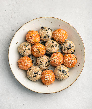 Korean Rice Balls (Jumeokbap) on a gray concrete background, top viewの写真素材