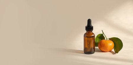 Vitamin C serum in a transparent brown glass bottle, selective focusの写真素材