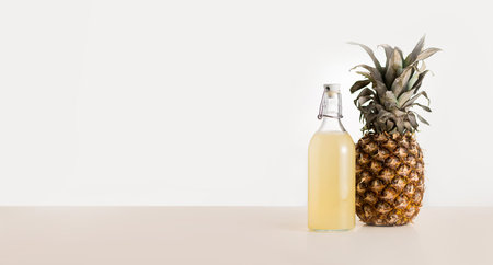 Fermented mexican pineapple beverage tepache in a glass jar, selective focus, copy spaceの写真素材