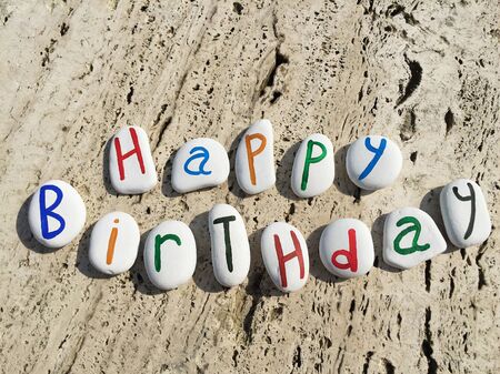Happy birthday greetings on colored stone lettersの素材