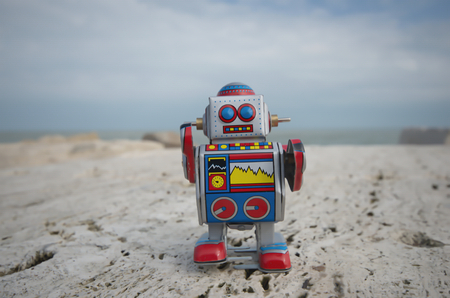 My sweet tin toy robot on the rocksの写真素材