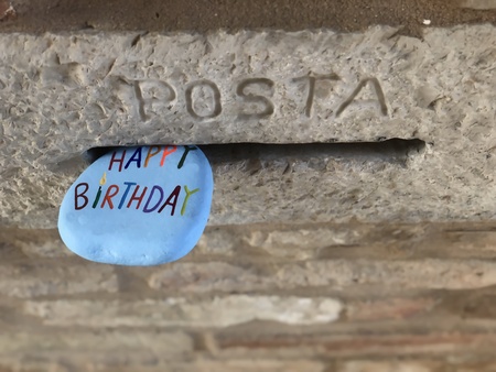 Happy Birthday stone in a mailbox holeの素材