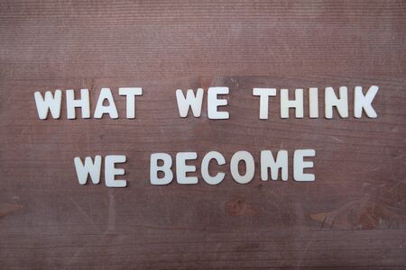 What we think, we become, Buddha quote composed with wooden letters on a wooden boardの写真素材