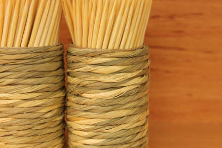 Wooden toothpicks on wooden background in detailの写真素材