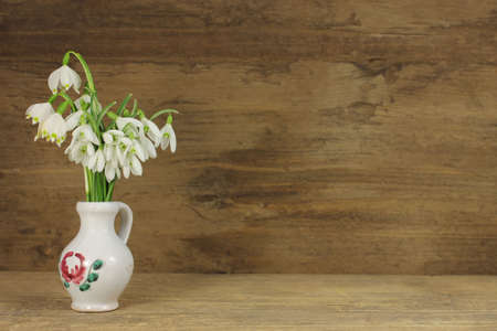 White snowdrops in detail on wooden backgroundの写真素材