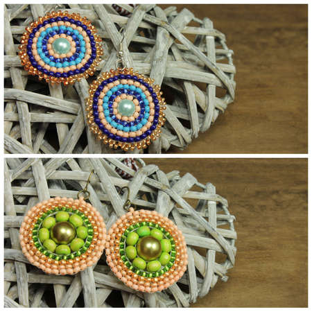Pair of colourful earrings on wooden backgroundの写真素材