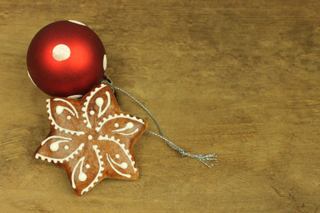 Gingerbread with white pattern in detail on wooden background