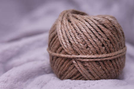 Little ball of string in detail on grey backgroundの写真素材