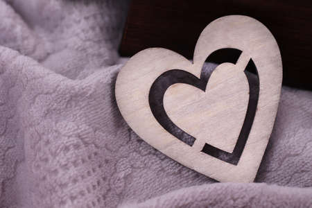 Decorative wooden heart in detail on grey backgroundの写真素材