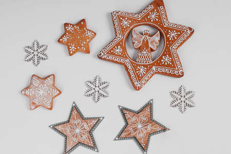 Decorated gingerbread and snowflakes in detail on white backgroundの写真素材