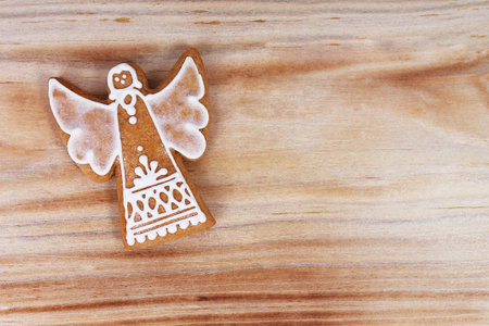 Decorated gingerbread in detail on wooden background