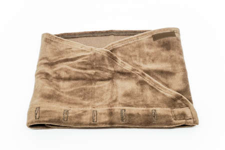 Brown towel headband for eyelash extension treatment on white background.の写真素材