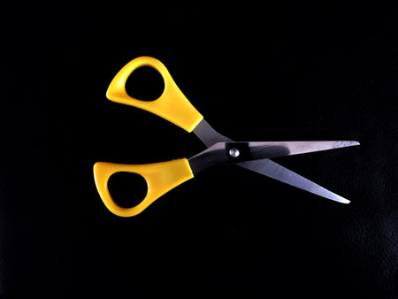 Scissors on dark background