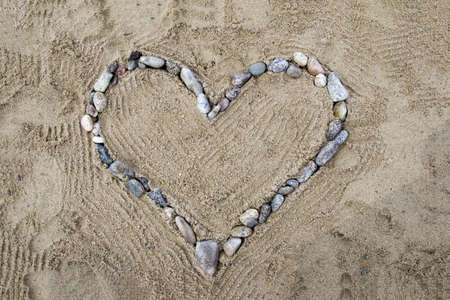 Heart of stones on Italian beach 3の写真素材