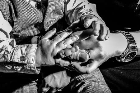 Many hands reaching up, isolated on beige onの写真素材