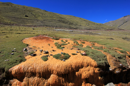 Nice orange sulfur stream in the andean mountains of Peruの写真素材