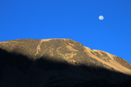 The rising sun at the Quyllurit'i inca festival in the peruvian andes near ausangate mountain, one of the oldest, nicest and most traditional religious ceremonies in the worldの写真素材