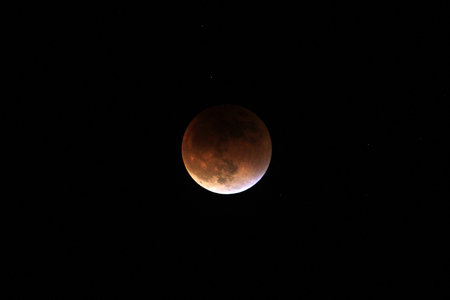Partial after total lunar eclipse 2015, also known as blood moon, photographed sep 27th, 8-11 pm, in...