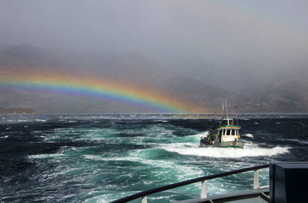 Fishing boat got rescued after struggeling for life in a storm, fiord in Bernardo OHiggins Nationa Park, Chileの写真素材