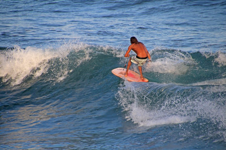 Matchless boogie boarder standing on the board and surfing, El Zonte beach, El Salvador, Central...