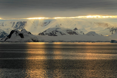 Antarctica landscape, icebergs, mountains and ocean at sunrise, Antarcticaの写真素材