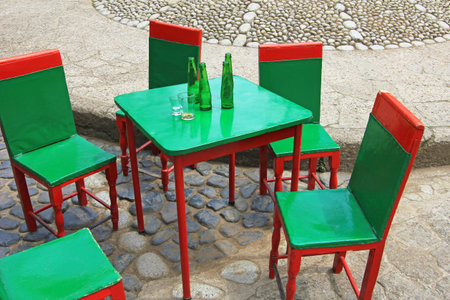 Colorful leather back coffee-house chairs and tables in the colonial town of El Jardin Colombia, South Americaの写真素材