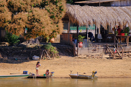 CORUMBA, MATO GROSSO, BRAZIL, JULY 23, 2018: Traditional indigenous girls along the Rio Paraguay river, Pantanal, near Corumba, Mato Grosso Do Sul, Brazil, South Americaのeditorial素材