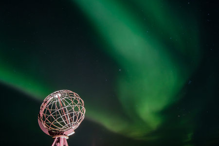 Northern lights, Aurora Borealis with the Globe, the monument at Nordkapp, North Cape, the most...