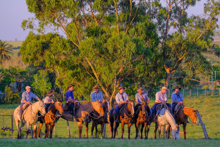 CAMINOS, CANELONES, URUGUAY, OCT 7, 2018: Gauchos on horses at a Criolla Festival in Uruguay, South America, also been seen in Argentina, Brazil and Chileのeditorial素材