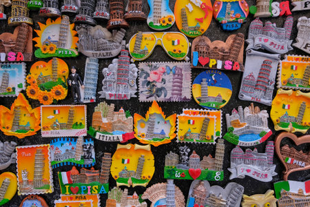Pisa, Tuscany, Italy, April 05, 2019: Magnets and shirts in a souvenir shop, showing the famous leaning tower of Pisa, Tuscany, Italy, Europeのeditorial素材