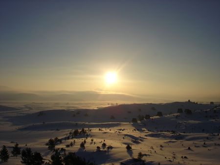 dawn on winter snow landscape        の写真素材