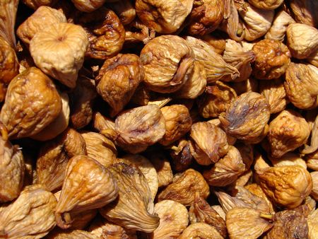 Brown dried figs on sun macro photoの写真素材
