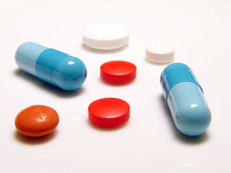 mixed pills on white background      の写真素材