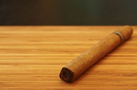 Close up of cigar on wooden tableの写真素材