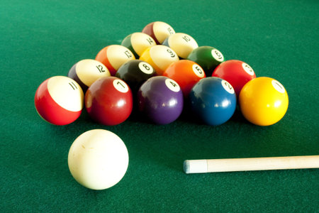 Billiard set on green billiard table