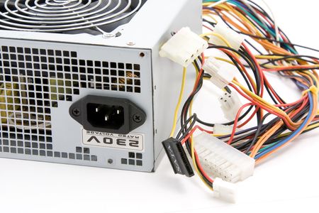 Used ATX computer power supply on white backgroundの写真素材