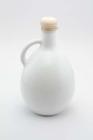Traditional ceramic oil bottle with wooden capの写真素材