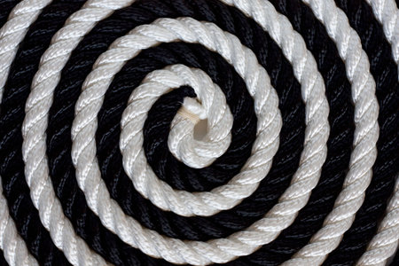 Black and white rope roll on white background