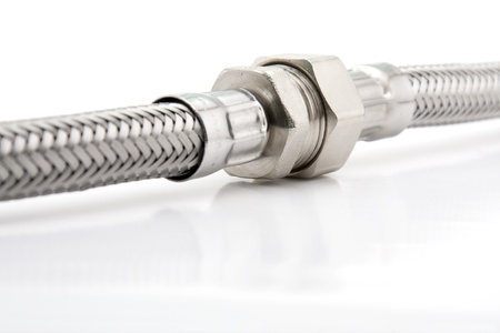 Connected braided stainless steel water hose on white backgroundの写真素材