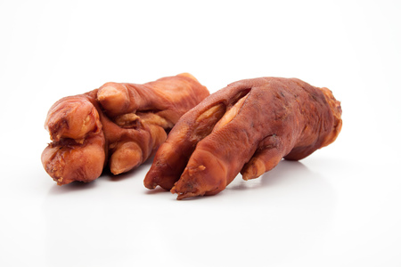 Dry smoked pork trotters on white backgroundの写真素材