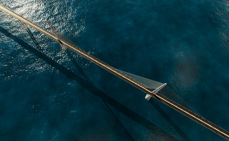 3d rendering of modern suspension bridge on blue ocean top viewの写真素材