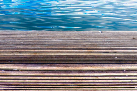 Wooden pier with blue sea in backgroundの写真素材