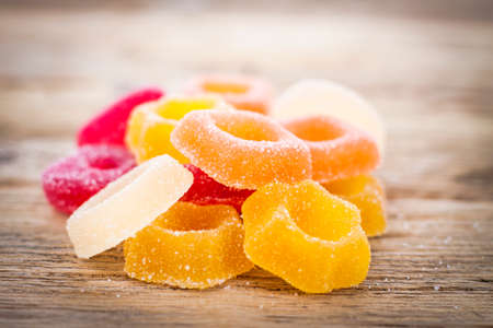 Colorful Jelly Candy on rustic wooden background close upの写真素材