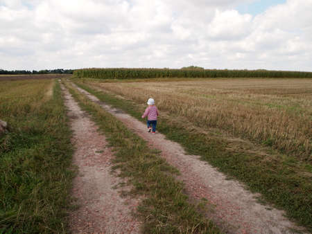 Little boy walking on path for going to the natureの写真素材