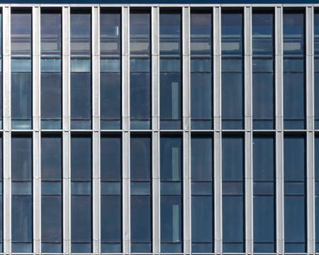 Shiny office building windows during the sunny day from outside viewの写真素材