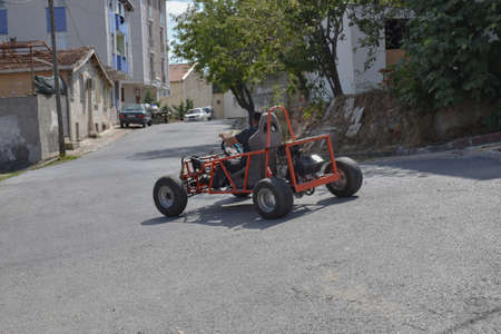 Go kart car going between narrow streetsの写真素材