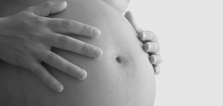 Mom caressing her belly