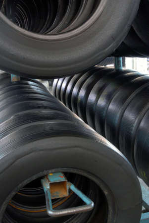 Hanged tires during industrial recycling process.の写真素材