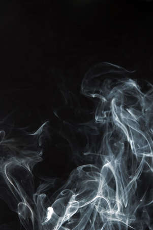 smoke floating in the air. Black background.の写真素材