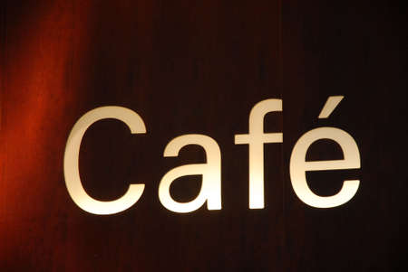Billboards Cafe at night on red and black tonesの写真素材